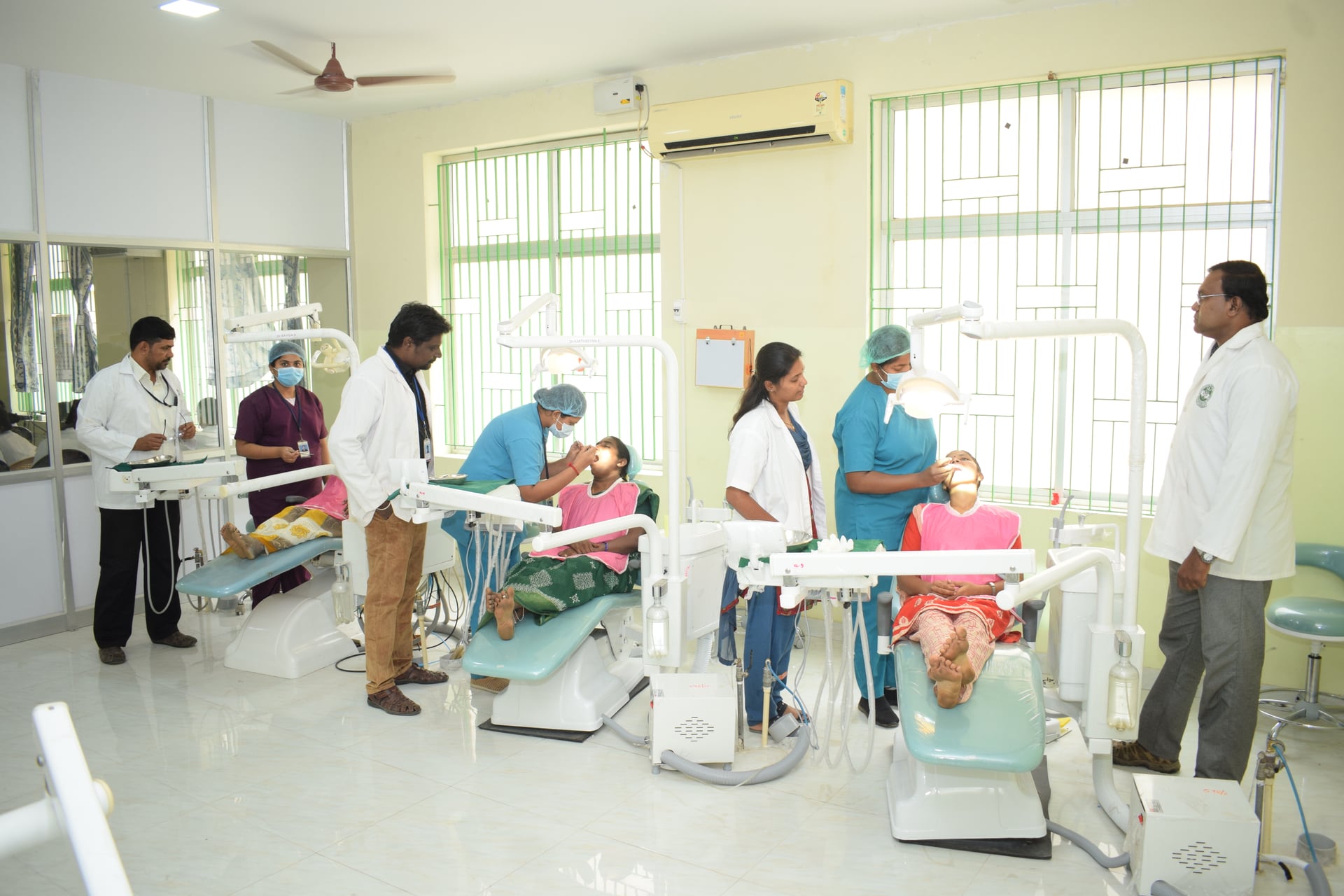 JKKN Dental College clinical training with dental chairs and faculty treating patients