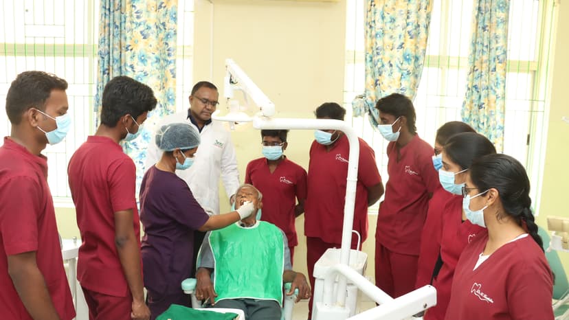 Faculty demonstrating clinical dental procedure to students at JKKN Dental College lab